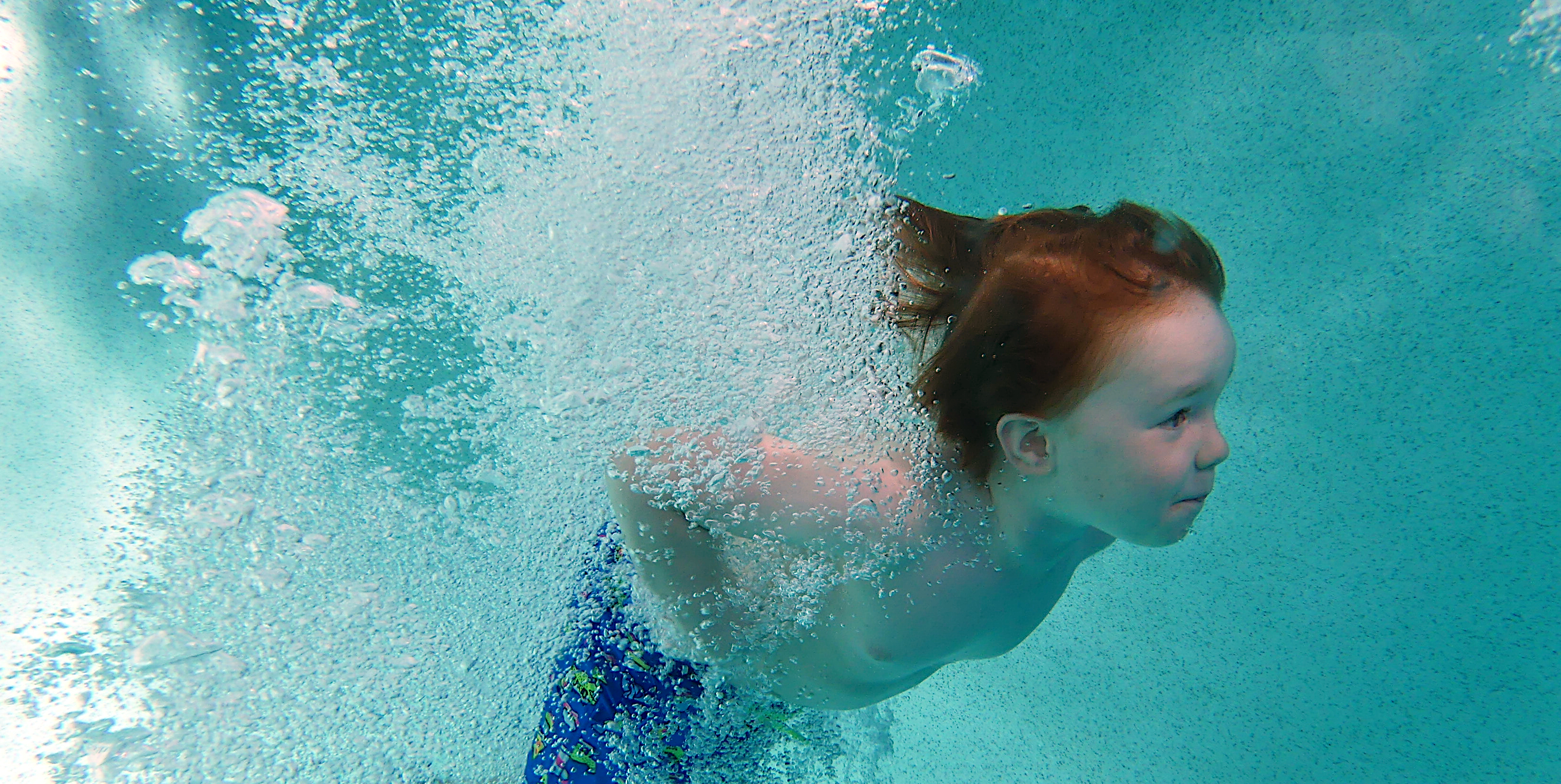 Swimmer underwater during a lesson